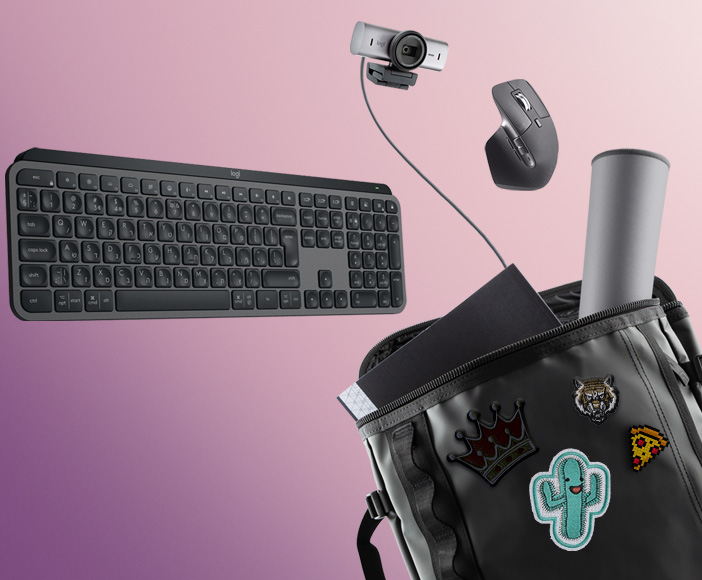 Wireless keyboard, mouse, and webcam floating above a backpack with patches as mobile office equipment