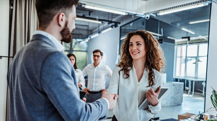 Two colleagues shaking hands