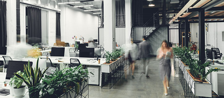 Workers walking through office